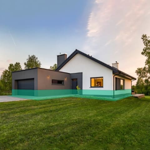 Ariel view of house with green band around the base of it.